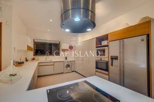 O bucătărie sau chicinetă la Penthouse 3 chambres Vue Lagon imprenable