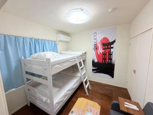 En eller flere senge i et værelse på ハイツ緑ヶ丘102