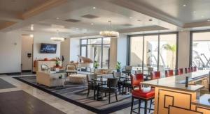 a lobby with tables and chairs and a living room at Ahern Hotel and Event Center in Las Vegas