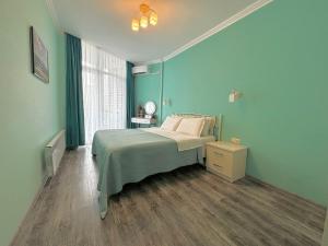 Ένα ή περισσότερα κρεβάτια σε δωμάτιο στο New apartments "Park Primorsky" +38 φωτογραφίες