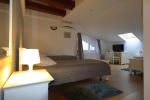 Ένα ή περισσότερα κρεβάτια σε δωμάτιο στο Kolpinghaus +26 φωτογραφίες