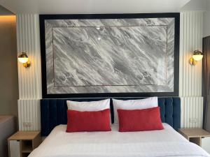 Ένα ή περισσότερα κρεβάτια σε δωμάτιο στο Baan Bangkok 97 Hotel