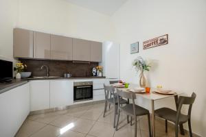 Η κουζίνα ή μικρή κουζίνα στο Martini Matera apartment +13 φωτογραφίες