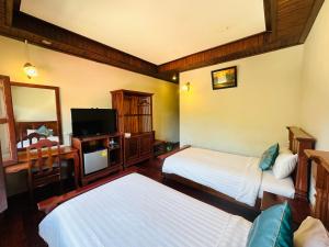 TV a/nebo společenská místnost v ubytování Villa Phounsab Tourist Street