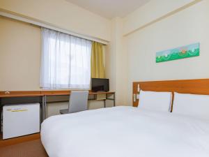 Ένα ή περισσότερα κρεβάτια σε δωμάτιο στο Comfort Inn Shiojiri Kita Inter