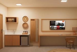 Televiisor ja/või meelelahutuskeskus majutusasutuses Wyndham Natal Pitangui Praia