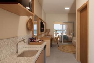 Televiisor ja/või meelelahutuskeskus majutusasutuses Wyndham Natal Pitangui Praia