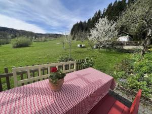 a table with a flower pot on top of it at Holiday apartment with 1 bedroom in Aich +32 photos