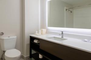 a bathroom with a white toilet and a sink at Quality Inn & Suites Circleville in Circleville +36 photos