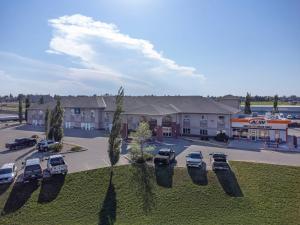 an aerial view of a parking lot in front of a building at Clarion Pointe in Rimbey