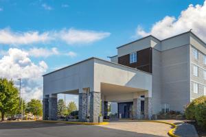 a building on a street with a blue sky at Comfort Inn & Suites Pottstown Eastern Gateway in Pottstown