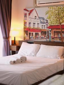 En eller flere senge i et værelse på APARTMENTS MBC