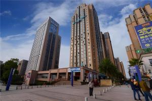 a group of tall buildings in a city at City Comfort Inn Chongqing Jiangbei Airport T3 Terminal in Chongqing