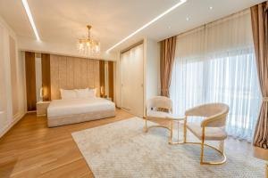 Ένα ή περισσότερα κρεβάτια σε δωμάτιο στο World Heart Residences