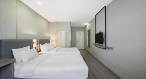 Μια τηλεόραση ή/και κέντρο ψυχαγωγίας στο 7 Days Inn Tianjin Railway Station