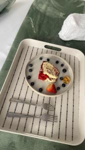 a piece of cake on a plate on a strainer at Blue Horizon Bed and Breakfast in Maseru +36 photos