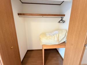 En eller flere senge i et værelse på ハイツ清水205