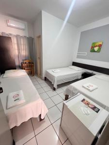 Postel nebo postele na pokoji v ubytování Fabiel Palace Hotel