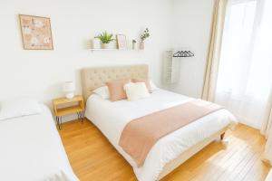 Ένα ή περισσότερα κρεβάτια σε δωμάτιο στο Paris & Disney 20 min +1 φωτογραφίες