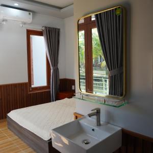 Giường trong phòng chung tại Homestay - Villa Ông Đề