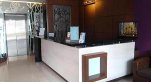 a lobby with a counter in a store at Grand Medallion Hotel in Kampong Tabuan