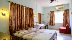 Ένα ή περισσότερα κρεβάτια σε δωμάτιο στο Sea Pearl Guesthouse