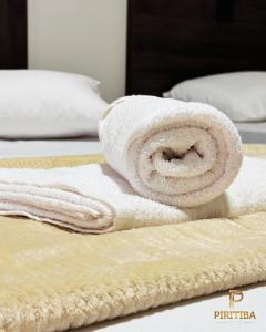 Postel nebo postele na pokoji v ubytování Piritiba Hotel