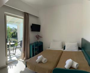 Ένα ή περισσότερα κρεβάτια σε δωμάτιο στο Three Stars Beach Hotel  +34 φωτογραφίες