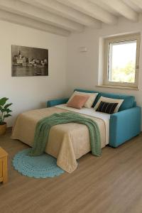 Ένα ή περισσότερα κρεβάτια σε δωμάτιο στο Casa vacanza Il Remo tra Lago di Garda e Montagne