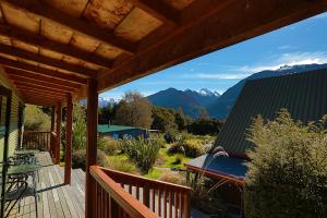 a deck with a view of the mountains at Mountainview Makarora Accommodation in Makarora