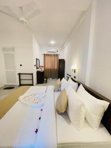 Ένα ή περισσότερα κρεβάτια σε δωμάτιο στο SKY Heaven