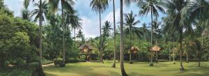 a resort with a large yard with palm trees at Rayavadee - Terrace Pavilion in Railay Beach