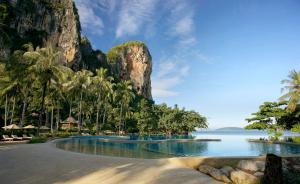 a resort with a swimming pool next to the ocean at Rayavadee - Pool Pavilion in Railay Beach