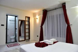 Ένα ή περισσότερα κρεβάτια σε δωμάτιο στο Araka Homes