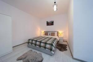 En eller flere senge i et værelse på Frapin House