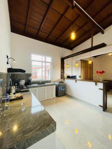 a large kitchen with a large counter in a room at SKY Heaven in Weligama +95 photos