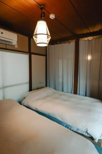 Φωτογραφία από το άλμπουμ του chidori4 伝統的な銭湯の上にある宿広々空間 銭湯無料体験 西九条駅 千鳥橋 USJ σε Wada