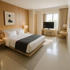 Una cama o camas en una habitación de Q Suite