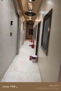 a long hallway with a row of stalls in a building at Shree Ram Palace in Ayodhya