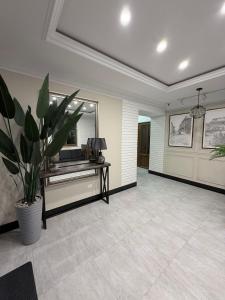 a living room with a mirror and a desk at Mali Home in Yerevan