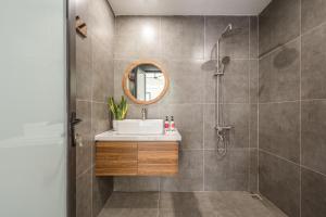 a bathroom with a sink and a shower at Sweet Home in Hanoi +133 photos