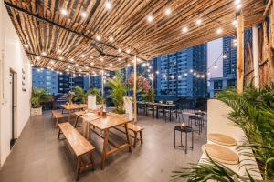 a restaurant with tables and chairs and a view of the city at Sweet Home in Hanoi