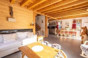 Posezení v ubytování Chalet La Tanière avec piscine et sauna - Vars Saint Marcellin
