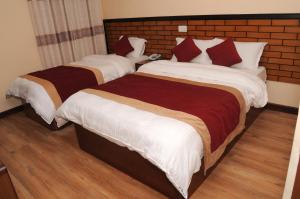 Letto o letti in una camera di Hotel Bagmati