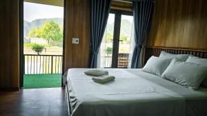 Ένα ή περισσότερα κρεβάτια σε δωμάτιο στο Tam Coc Holiday Retreat +84 φωτογραφίες