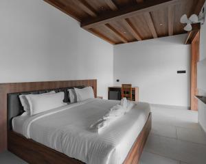 Ένα ή περισσότερα κρεβάτια σε δωμάτιο στο mayanadhi resort