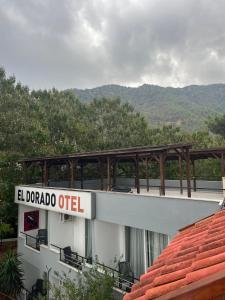 a building with a sign that reads el dorado outlet at Eldorado Hotel in Kumluca +7 photos