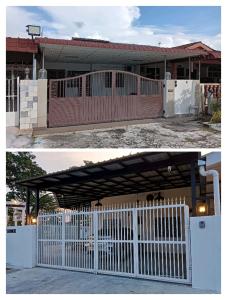 ein weißer Zaun vor einem Haus in der Unterkunft HT Home in Ipoh