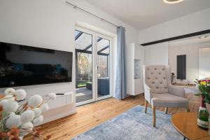 Una televisión o centro de entretenimiento en Ferienwohnung Finn EG