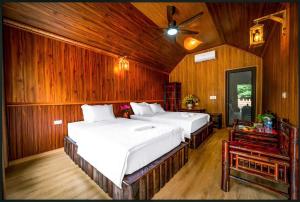 En eller flere senge i et værelse på Tam Coc Holiday Retreat + 69 billeder